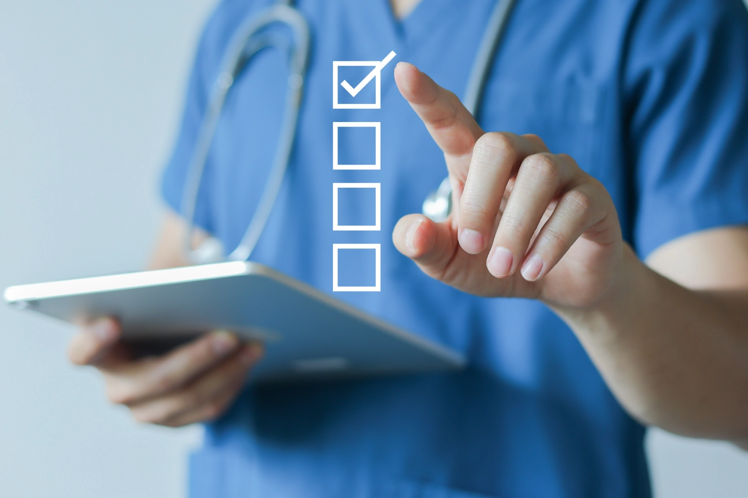 Doctor selecting an option on a virtual checklist.