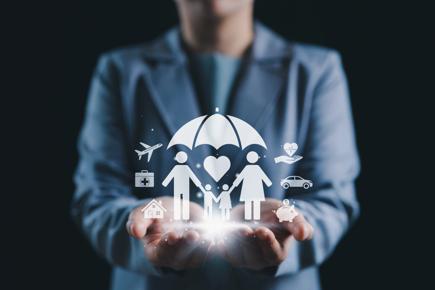 Person holding holographic insurance icons under an umbrella.